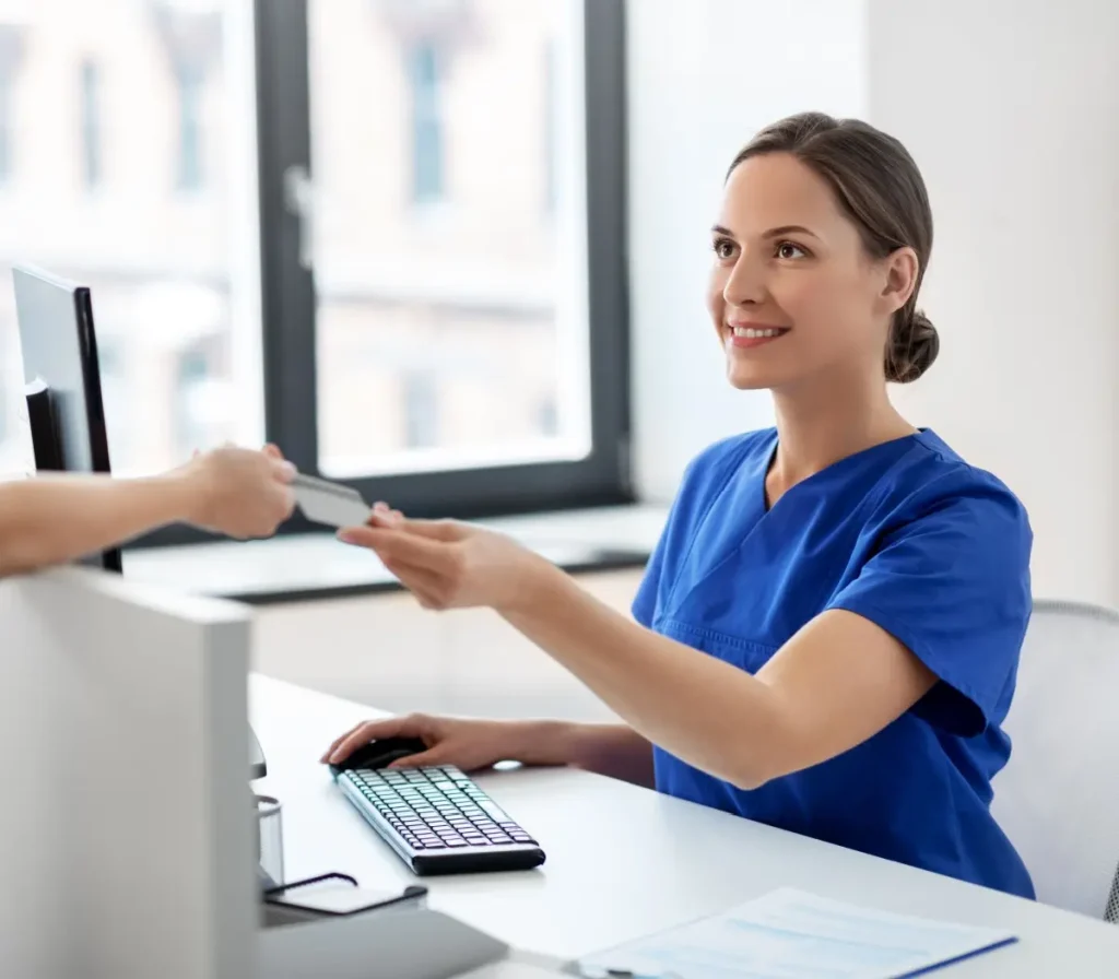 nurse and patient with credit card