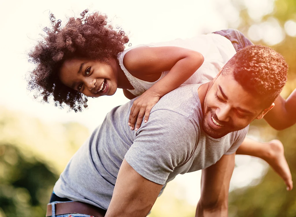 happy man and child playing